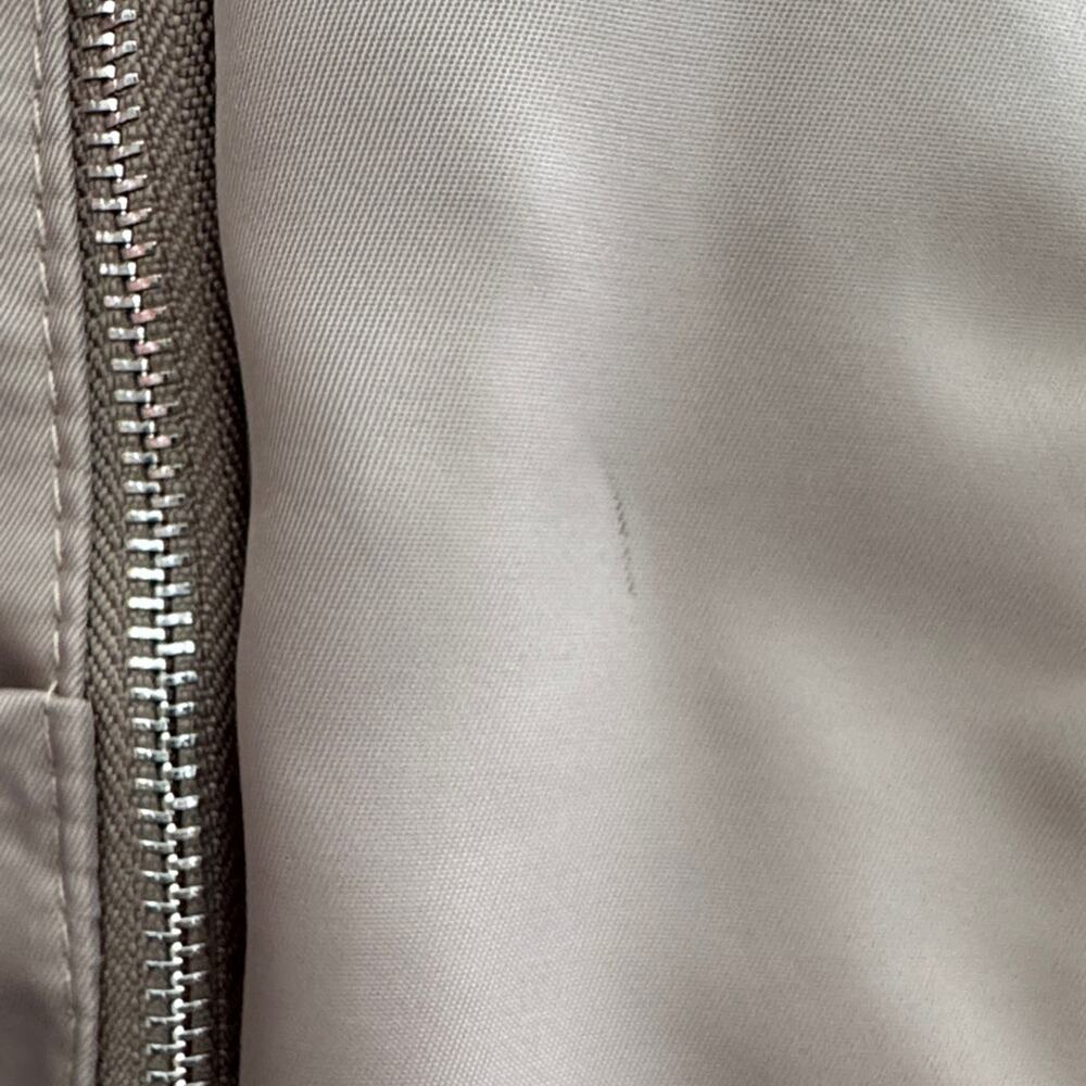 Neutral Taupe Woman’s Backpack with Metallic Accent and many zipper pockets. - Picture 9 of 13